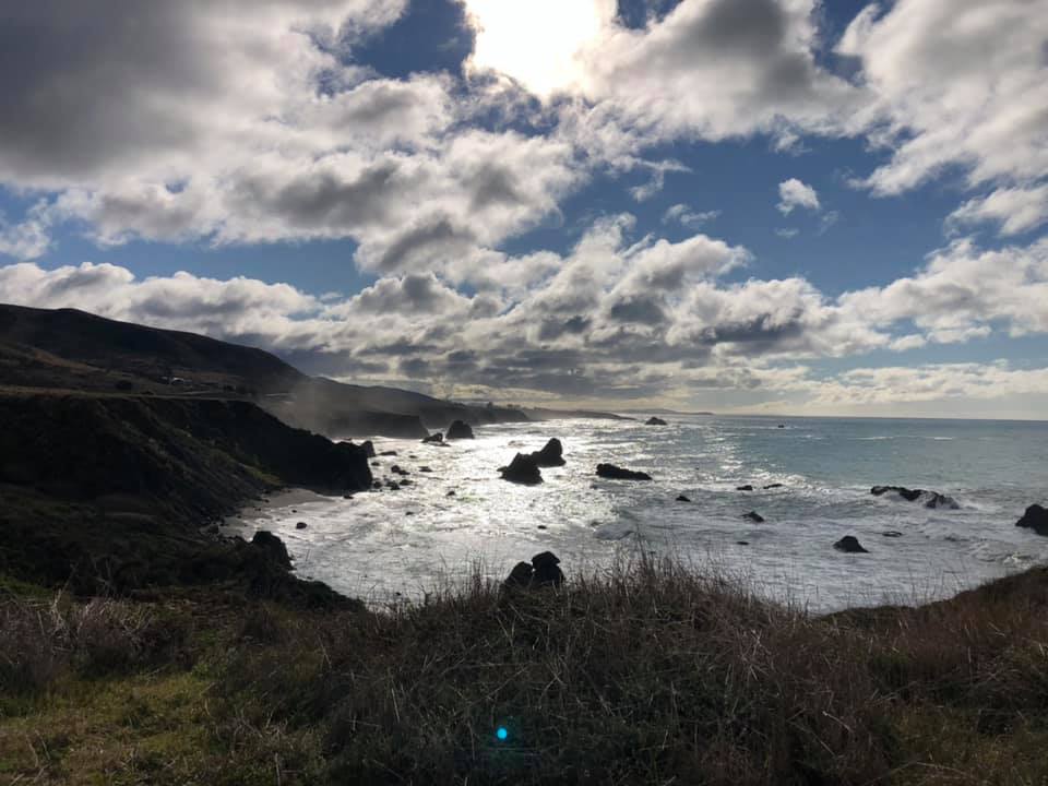 Teen journals on the coast above Shell Beach