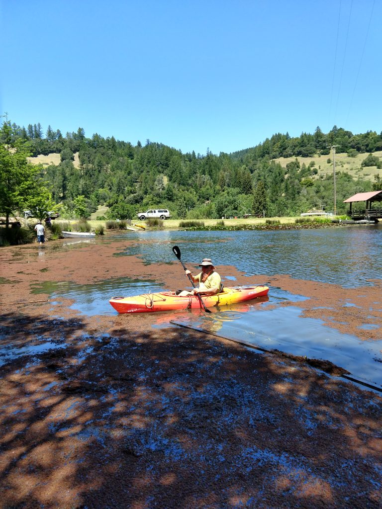 man in a kayak on a pond at Rancho Mark West